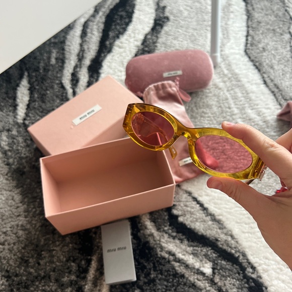 Miu Miu Accessories - Miu Miu Amber Transparent Frame Sunglasses